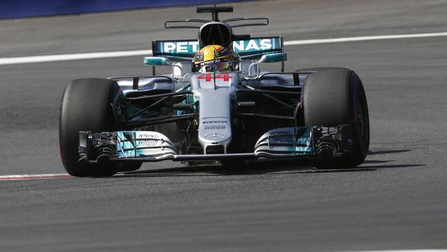 Mercedes driver Lewis Hamilton steers his car during the first free practice session.