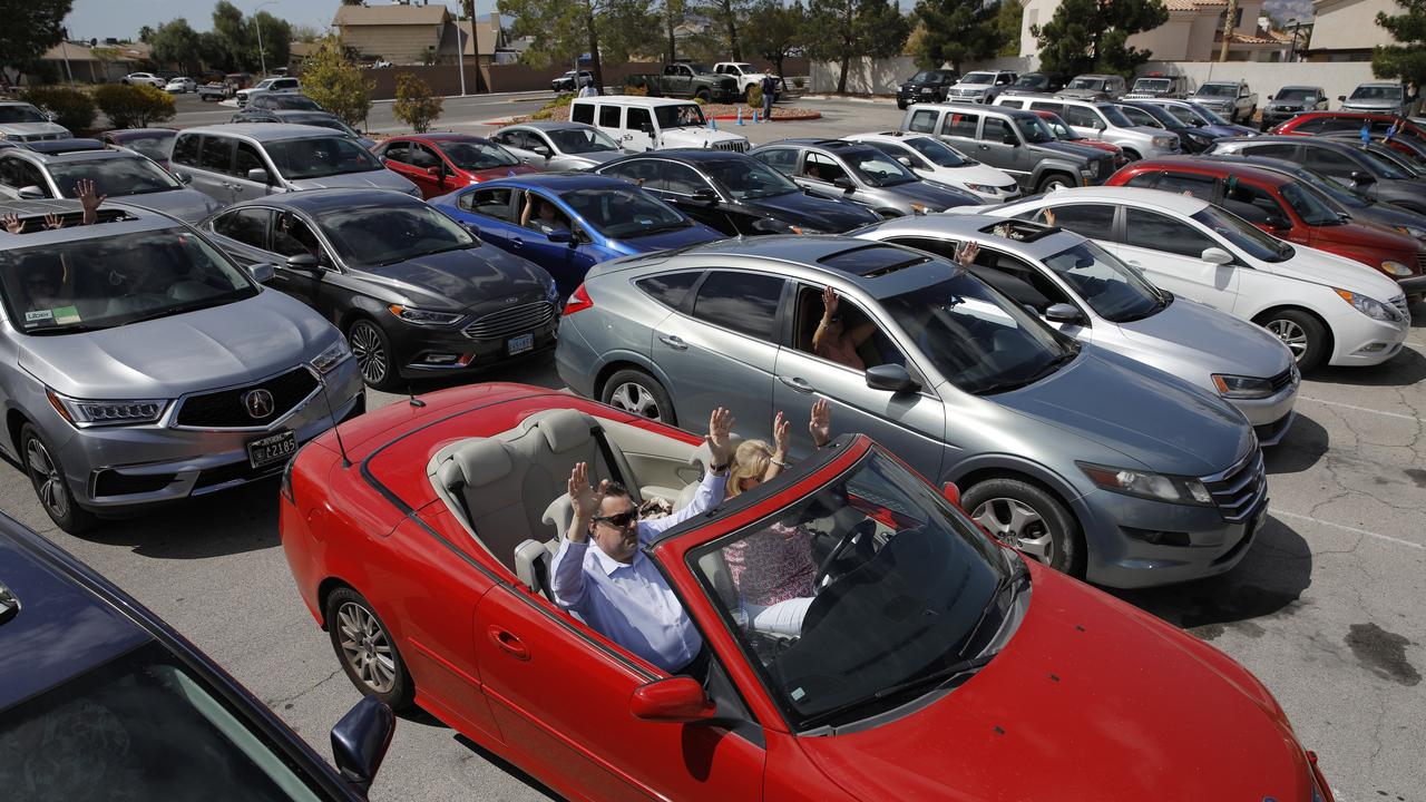 People pray in their cars at an Easter drive-in service at the International Church of Las Vegas on Easter Sunday. Picture: John Locher/AP