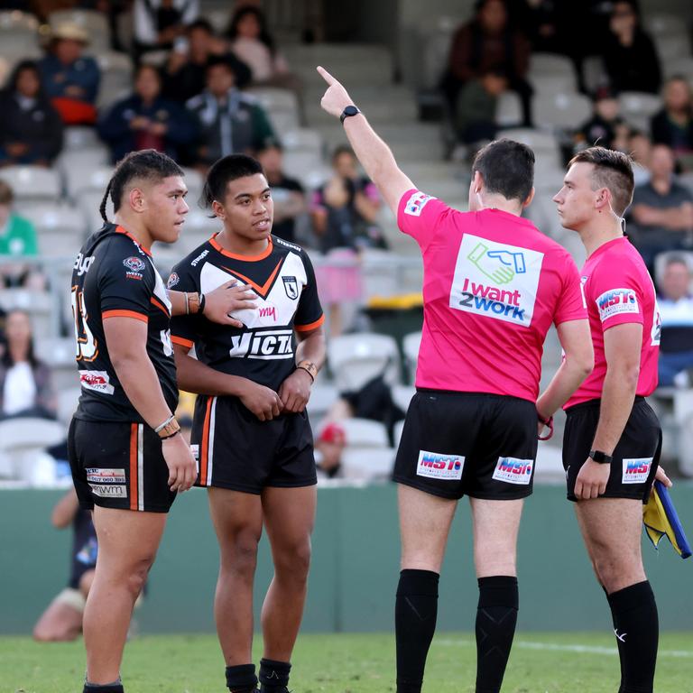 The ref gives a Magpies player his marching orders.