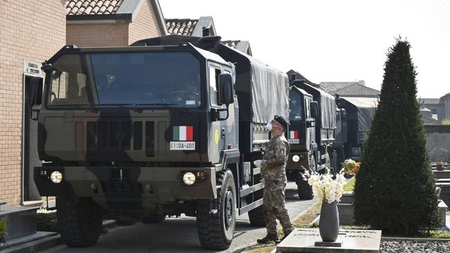 A convoy of Italian Army trucks carrying the bodies of coronavirus victims arrives at Ferrara cemetery from Bergamo. Picture: AP