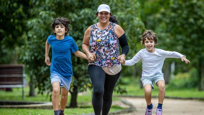 Eleana Sikiotis exercises with her sons Luca, 9 and Nico, 6. Picture: Jake Nowakowski