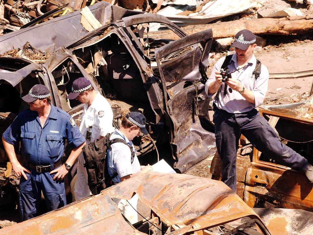 Australian Federal Police investigators walk through debris at the Bali nightclub bombing site October 17, 2002 in Denpasar, Bali, Indonesia. Picture: Edy Purnomo/Getty Images