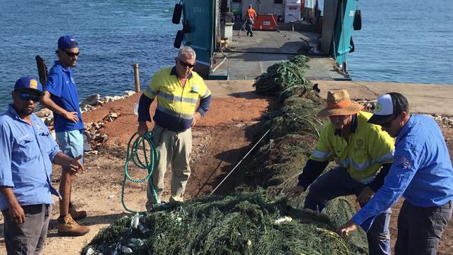 A ghost net is hauled aboard a barge in the Gulf of Carpentaria. . Photo: Anindilyakwa Rangers