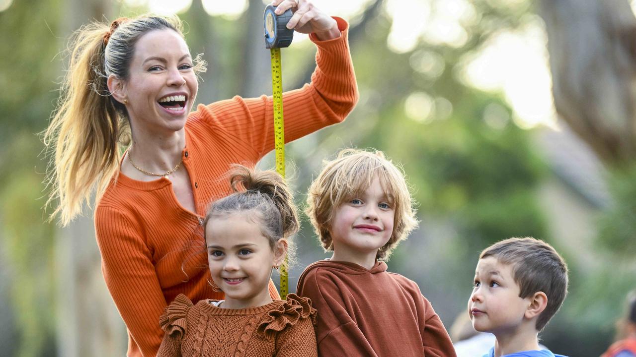 Emily Griffiths checks the height of three five-year-olds – Mia Swiecinski, her son Lenny Jones and George Lingley. Picture: Mark Brake