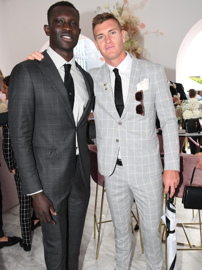 AFL footballers Majak Daw and Adam Tomlinson. Picture: AAP