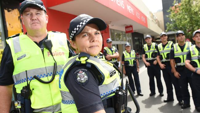 Charges against Frankston cop Michael Lamb (far left) for allegedly leaking sensitive crime data to 3AW’s Neil Mitchell to further his political career have been thrown out.