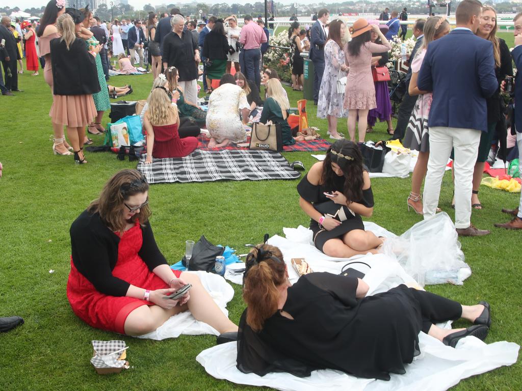 Racegoers are seen during the Lexus Melbourne Cup Day, as part of the Melbourne Cup Carnival, at Flemington Racecourse in Melbourne, Tuesday, November 6, 2018. (AAP Image/Dave Crosling) NO ARCHIVING, EDITORIAL USE ONLY