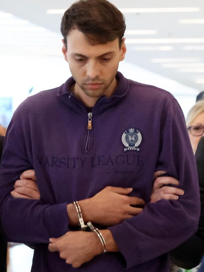 Zacharia Bruckner flanked at Adelaide Airport after being extradited from Queensland. Picture: NCA NewsWire/Kelly Barnes