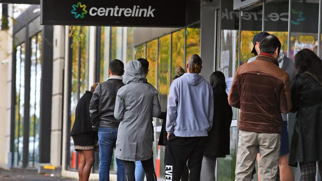 People queue up outside a Centrelink office in Melbourne. Picture: AFP