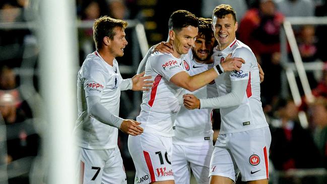 Alexander Baumjohann, centre, celebrates with his Wanderers teammates after scoring against Bonnyrigg last night.