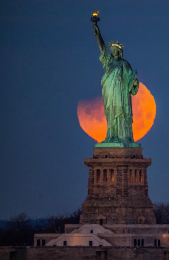 The super blue blood moon captured with the Statue of Liberty in the foreground. Picture: Khordi Photography