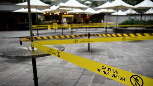 Taped off tables and chairs at a cafe in Sydney. Picture: AAP.