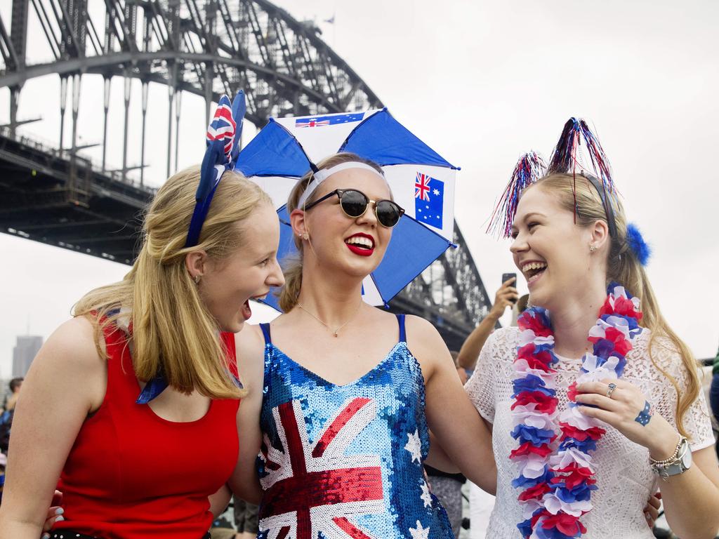 Madeleine Pagett (red top) , Lucinda Pagett (Australias dress) and Lucy Brice enjoy Australia Day at Circular Quay in Sydney. Picture: Jenny Evans