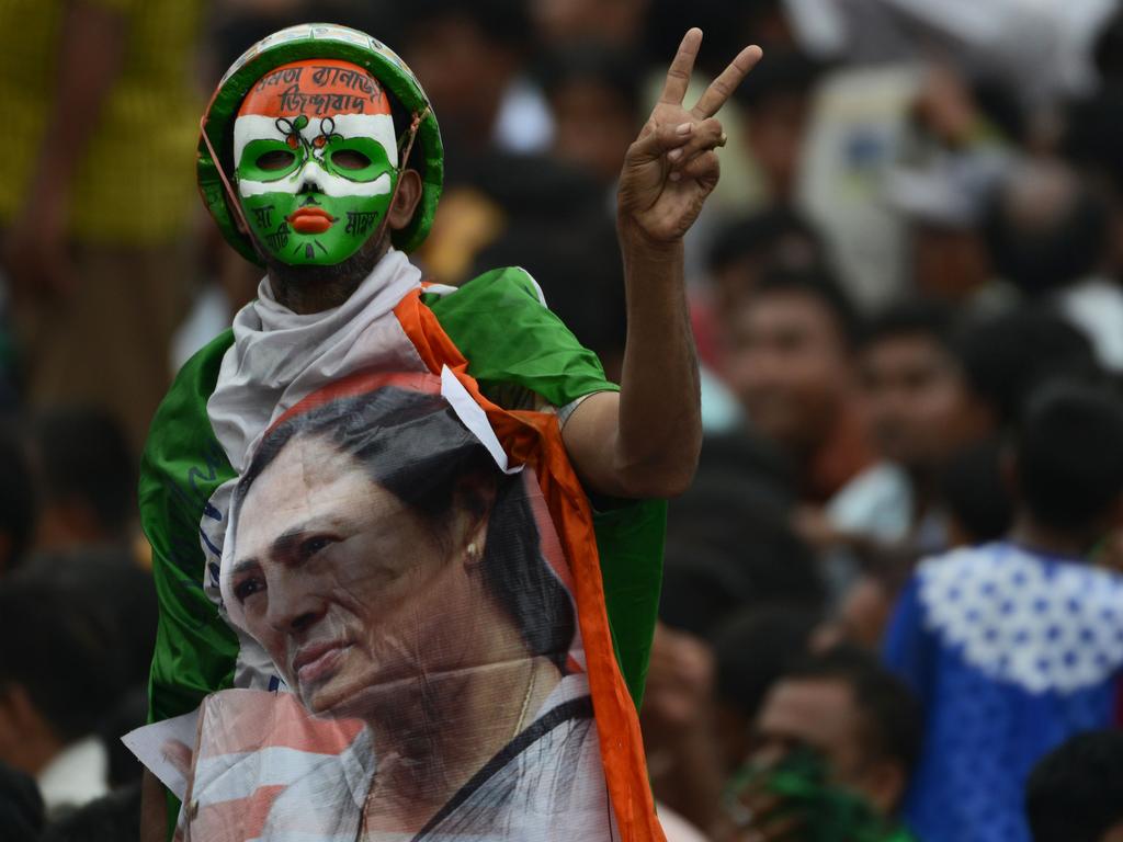 Hundreds of thousands of Indian Trinamool Congress Party (TMC) supporters attend a mass meeting addressed by West Bengal chief minister and TMC chief Mamata Banerjee in Kolkata on July 21, 2016. The event was held to commemorate 13 activists killed by security forces on July 21, 1993 during a West Bengal Youth Congress rally demanding that the voter’s identity card be made the sole requirement for voting. / AFP PHOTO / Dibyangshu SARKAR