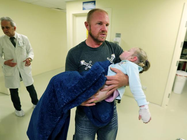 Adam Potts holds his daughter Annabelle at the OCA Hospital in Monterrey Mexico where she underwent scans on her brain tumour. Picture: Nathan Edwards