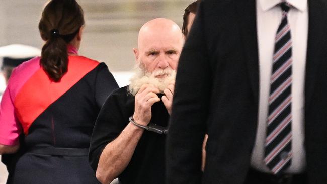 Keith Lees arrives at Brisbane airport as he is extradited from Sydney to Brisbane to face court in Brisbane in relation to the alleged cold case murder of Meaghan Rose almost 30 years ago. Picture: Dan Peled / NewsWire