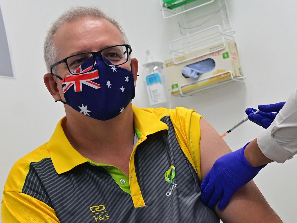 Scott Morrison receives a dose of the Pfizer/BioNTech Covid-19 vaccine in February. Picture: Steven Saphore/AFP