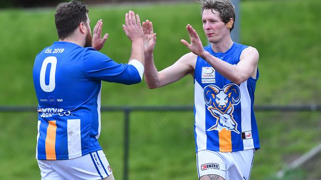 Well done mate! Croydon North MLOC’s Timothy Legg pulls on the No. 0 jumper to help the TAC. Picture: Josie Hayden