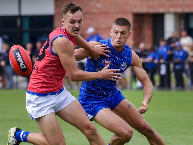 Darcy Tucker and Geordie Payne fight for possession during a North Melbourne intraclub match. Picture: Ian Currie