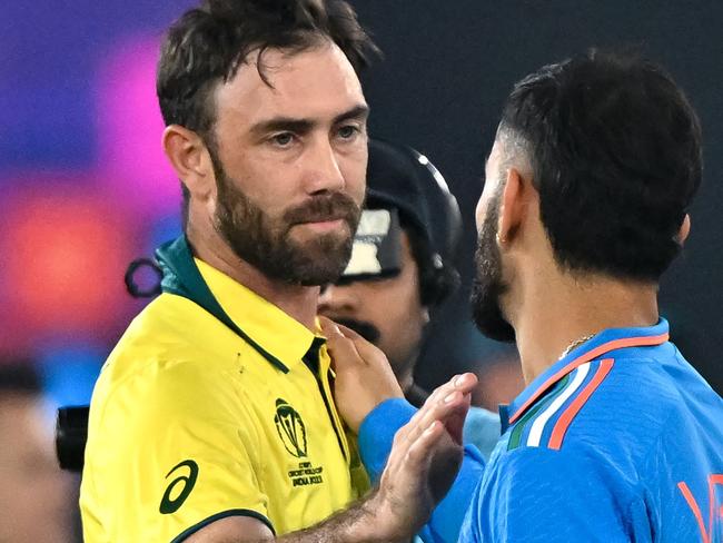 India's Virat Kohli greets Australia's Glenn Maxwell (L) at the end of the 2023 ICC Men's Cricket World Cup one-day international (ODI) final match between India and Australia at the Narendra Modi Stadium in Ahmedabad on November 19, 2023. (Photo by Sajjad HUSSAIN / AFP) / -- IMAGE RESTRICTED TO EDITORIAL USE - STRICTLY NO COMMERCIAL USE --