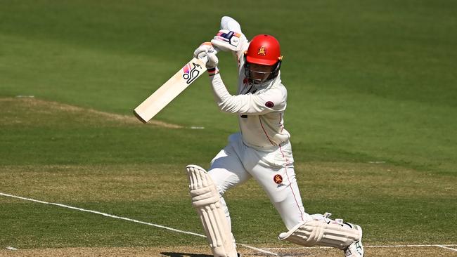 South Australian keeper Alex Carey blasted two fours through the covers as part of a three-ball assault to reach his second first-class ton of the summer. Picture: Albert Perez / Getty Images