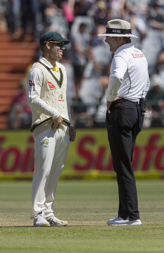 David Warner talks to the umpire during play.