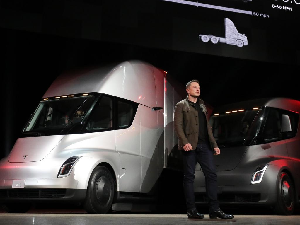 Tesla boss Elon Musk with Tesla Semi concept vehicles.