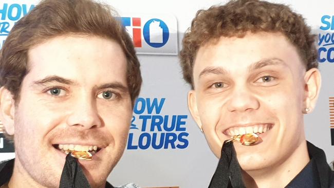 Joint 2019-20 Nichols medallists Brodie Filo, left and Beau O'Connell get a taste of their medals. Picture: GREY MORRIS