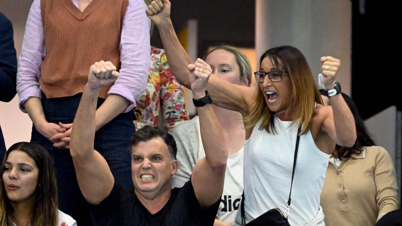 Lewis (R) and husband Greg Taylor (C) cheer on their son Kai Taylor to victory in the men's 200m freestyle swimming final at the 2023 Australian World Championship Trials. Picture: William West