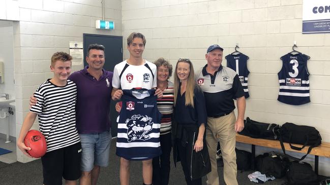 Broadbeach Cats player Aiden Fyfe and his family after being presented his guernsey ahead of his QAFL debut. Picture: Supplied.