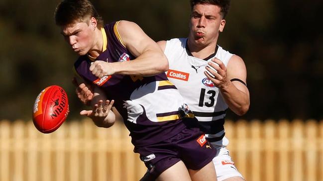 Josh Walker fires off a handball for the Chargers. Photo by Daniel Pockett/AFL Photos/via Getty Images