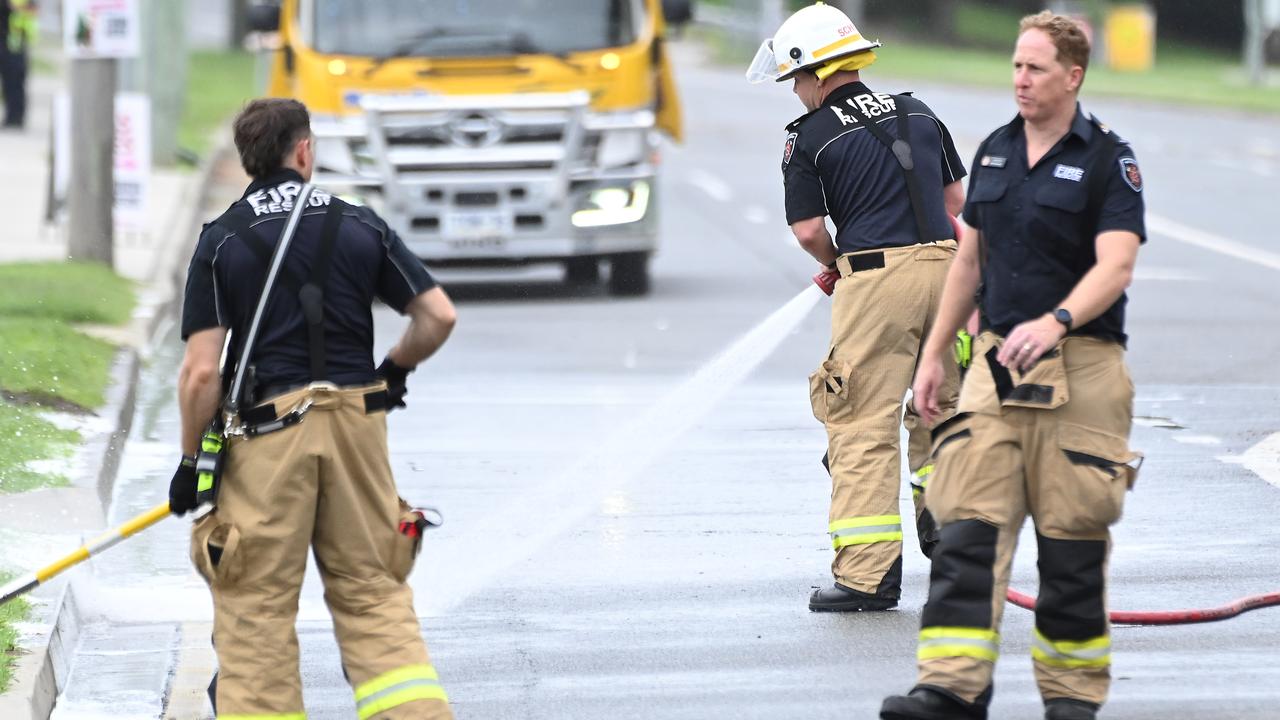 Firefighters remained on the scene in the wake of the fiery crash. Picture: John Gass