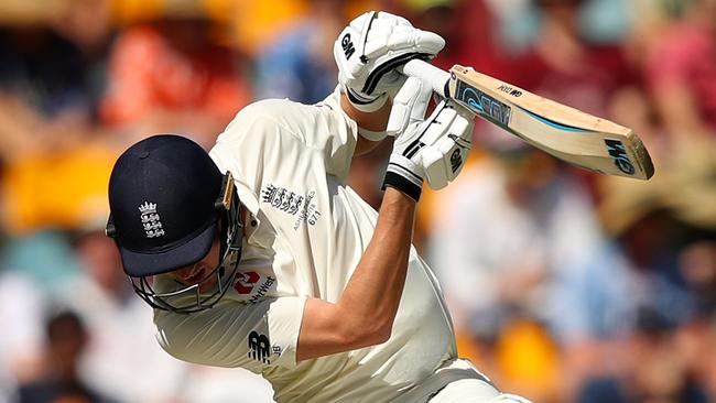 England’s Jake Ball avoids a Pat Cummins lifter in the first Test in Brisbane.