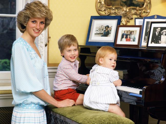 The brothers with their late mother, Diana, Princess of Wales, at the piano in Kensington Palace. Picture: Tim Graham Photo Library via Getty Images