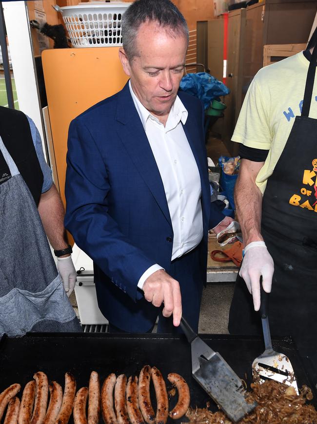 Federal Labor leader Bill Shorten turns sausages after voting at Moonee Ponds West Primary School during last year’s state election. Picture: AAP