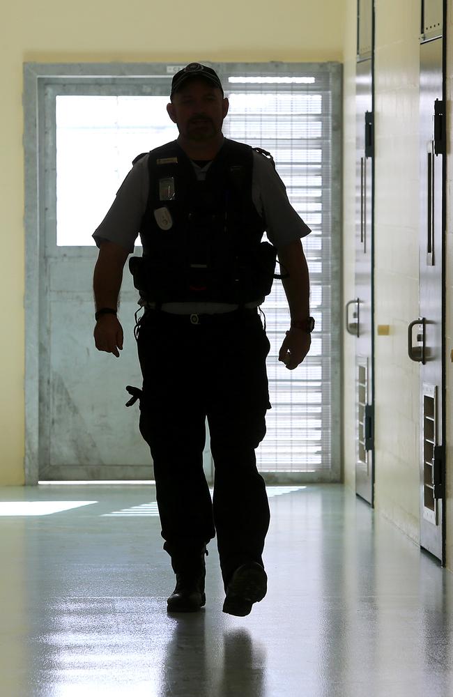 A corrections officer walks through a prison. (AAP Image/Jono Searle)