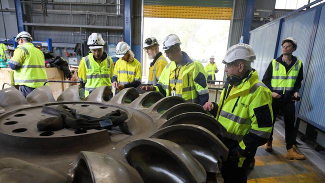 Engineer Mike Wallis (right) has clocked up 60 years with Hydro Tasmania and Entura. Picture: Colin Terry/ Hydro Tasmania