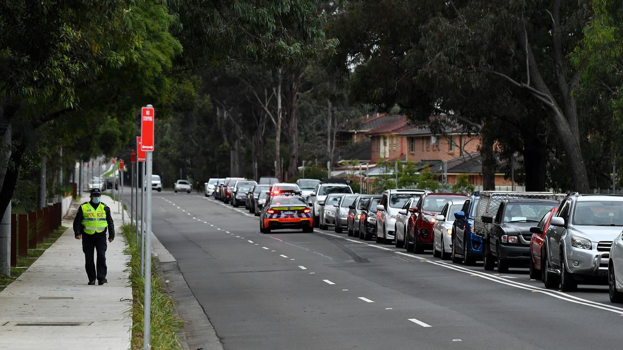 People queue in cars at the Fairfield Showground Covid testing site in Sydney on Wednesday. Picture: Joel Carrett/NCA NewsWire