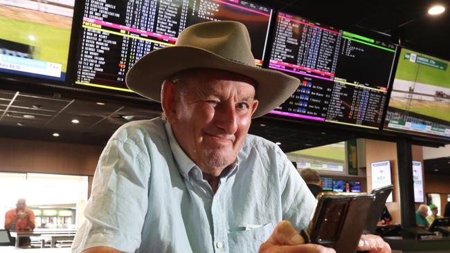 Thursday edition of Magic Millions at Gold Coast Turf Club. Doug Oldfield from Sydney studies the field in the betting ring. Picture Glenn Hampson