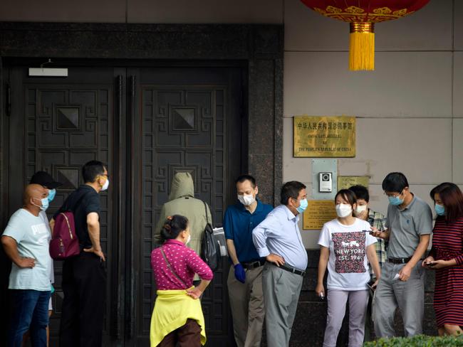 People gather outside the Chinese consulate in Houston after the US ordered it to close. Picture: AFP