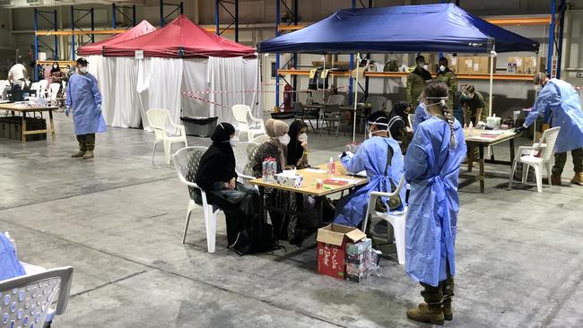 Australian Defence Force personnel process the first evacuees from Kabul at Australia’s base in United Arab Emirates. Picture: ADF