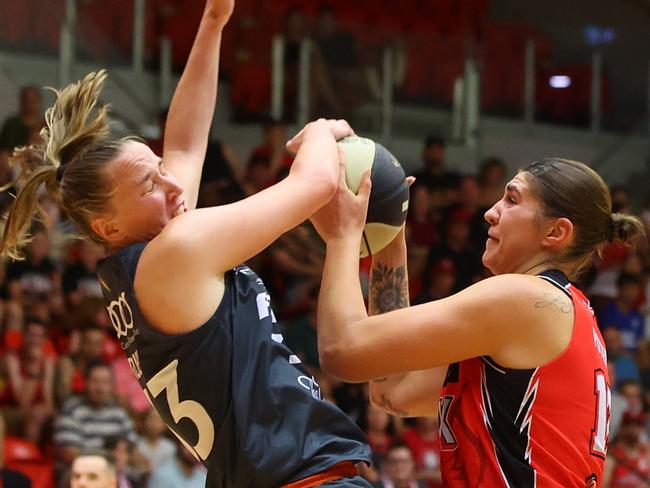 PERTH, AUSTRALIA - MARCH 03:  Emily Potter of the Lynx charges into Mikaela Ruef of the Fire during game two of the WNBL Semi Final series between Perth Lynx and Townsville Fire at Bendat Basketball Stadium, on March 03, 2024, in Perth, Australia. (Photo by James Worsfold/Getty Images)