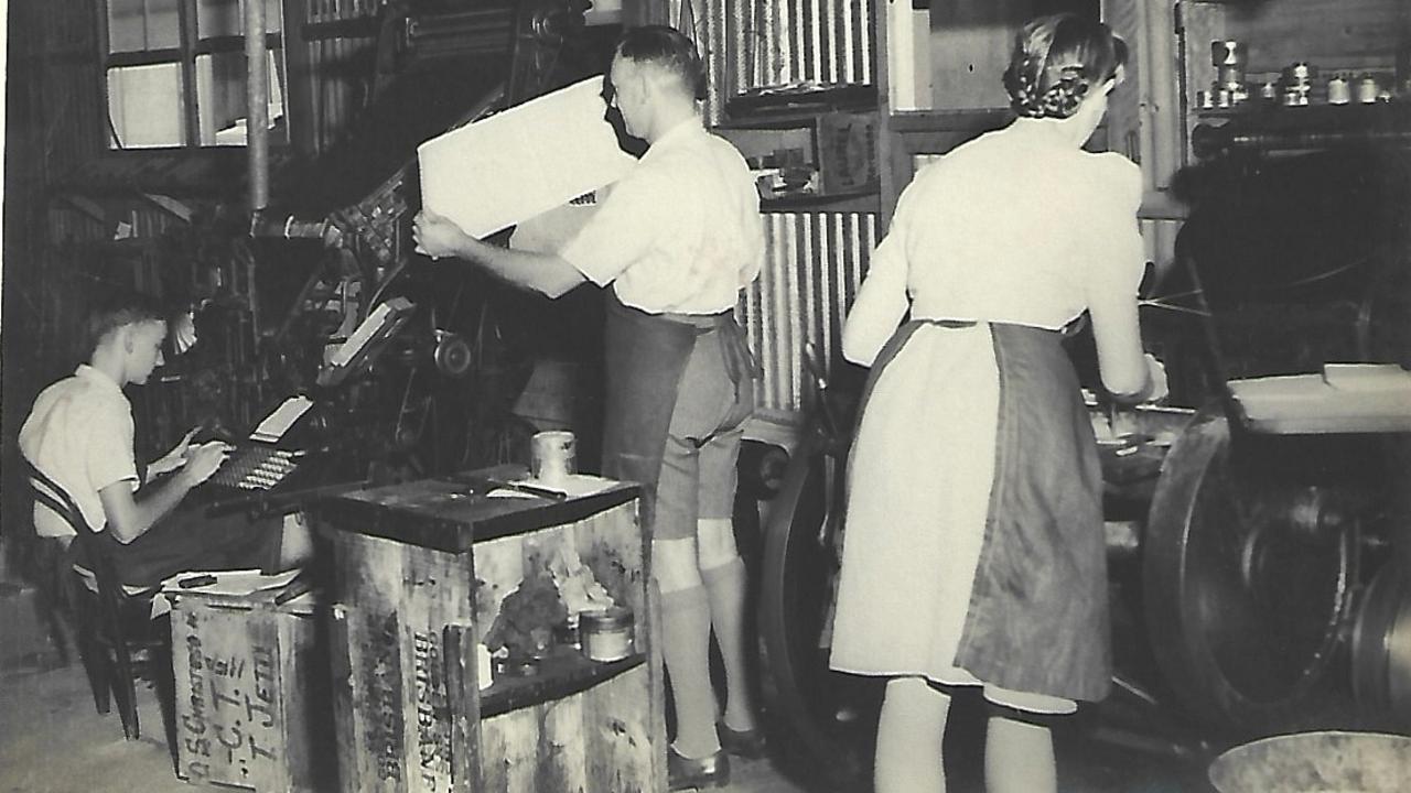 A family photo in the Macdonald Printing shop in the 40's. Stewart is operating the linotype, Jack Macdonald is looking at what is likely a proof, and a lady is hand-feeding a Chandler & Price press.