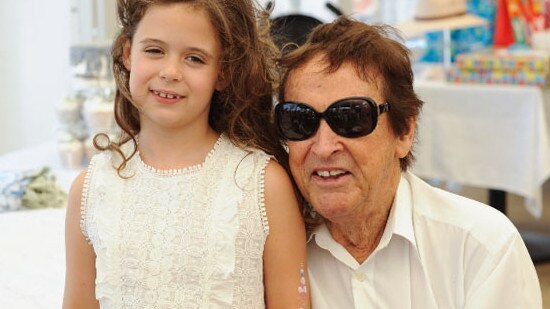 Former Hawthorn AFL player and aerobic fitness pioneer Brendan Edwards pictured with granddaughter Addison