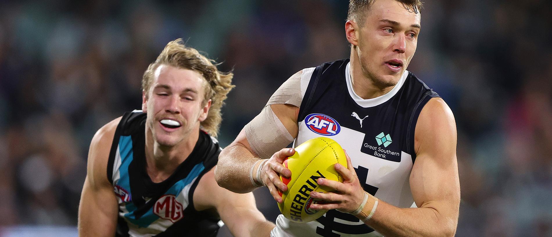 ADELAIDE, AUSTRALIA - MAY 30: Patrick Cripps of the Blues and Jason Horne-Francis of the Power during the 2024 AFL Round 12 match between the Port Adelaide Power and the Carlton Blues at Adelaide Oval on May 30, 2024 in Adelaide, Australia. (Photo by Sarah Reed/AFL Photos)