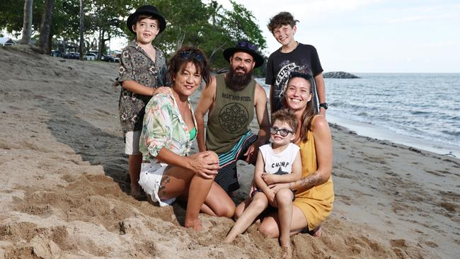 One year on from the flood that devastated the Holloways Beach community, an informal gathering was orgaised for locals on the beachfront to gather, talk and support one another. Organiser Crystal MacLennan and her nephew Archie Hughes, 7, pictured with flood survivors Carter Edwards, Dan Cairns, Sami Keeble and her son Lance Keeble, 6, pictured on Holloways Beach. Picture: Brendan Radke