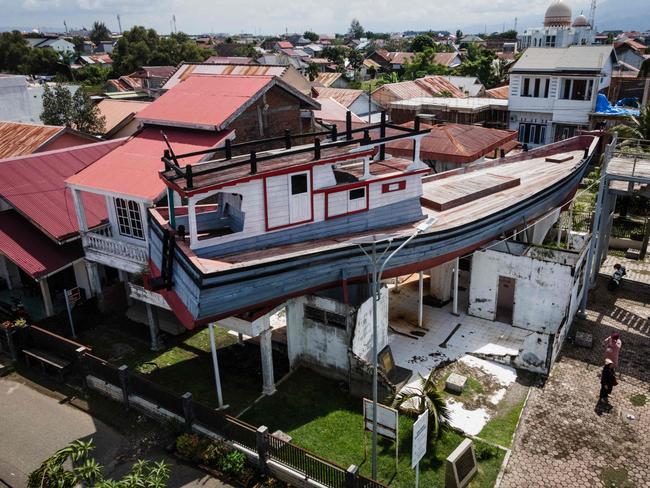 The boat remains preserved after being swept onto a roof by the 2004 tsunami in Banda Aceh. Picture: AFP