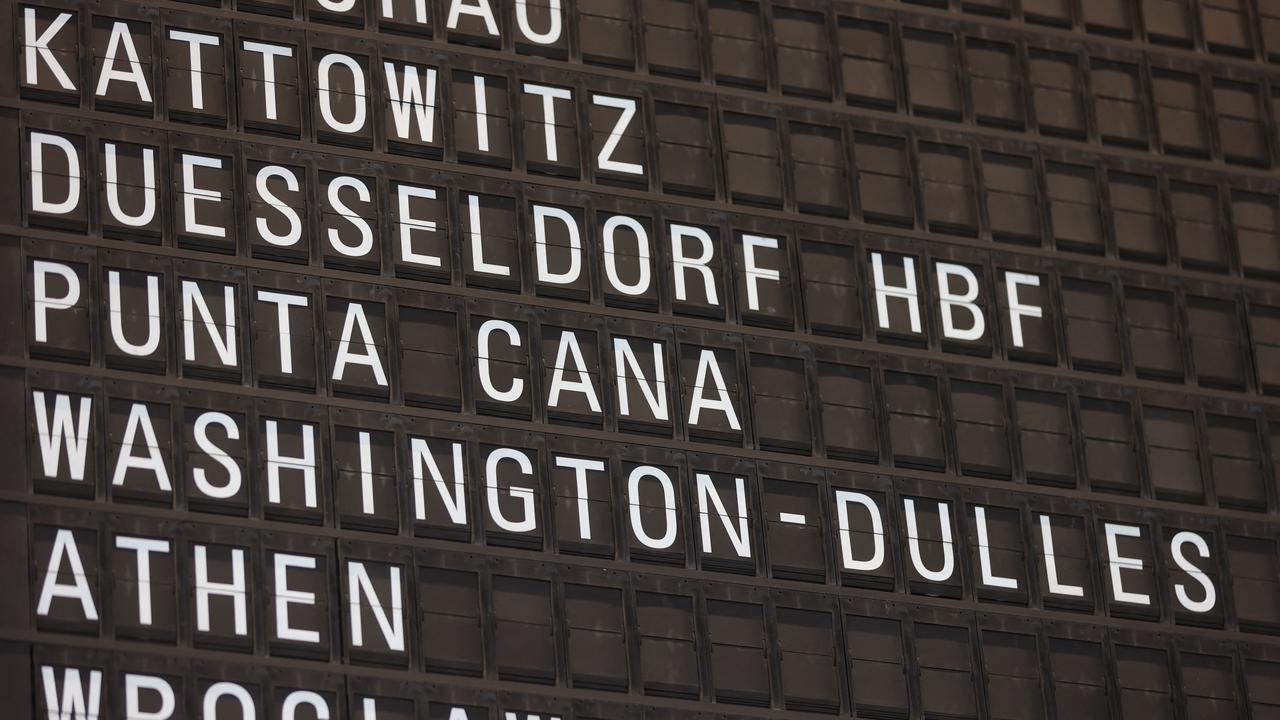 A screen listing a flight to the United States is pictured at the airport in Frankfurt. Picture: AFP