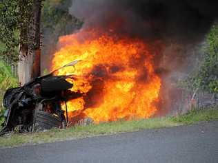 Firefighters attended to a car on fire on Rammutt Rd at Chatsworth on Sunday. Picture: Josie Laird