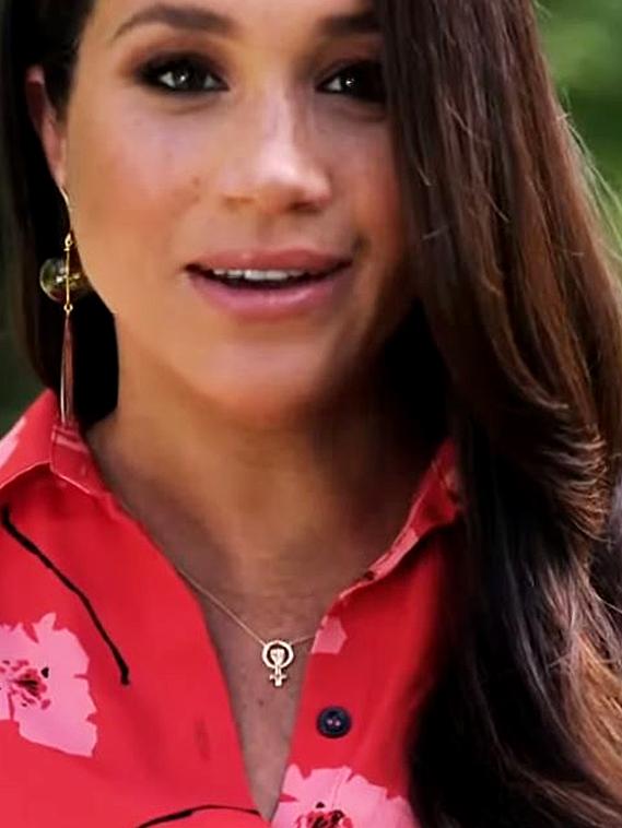 Meghan Markle sported a Woman Power pendant.